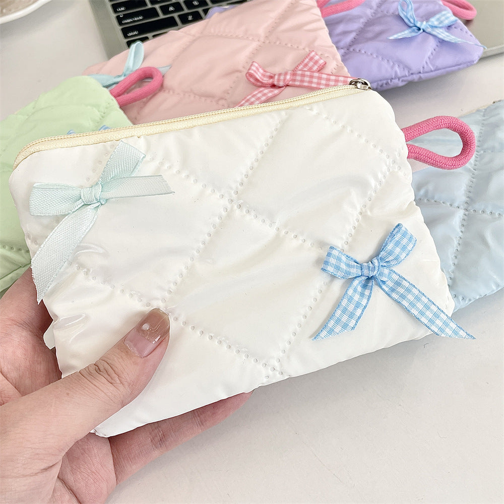 リボンモチーフキルティングポーチ