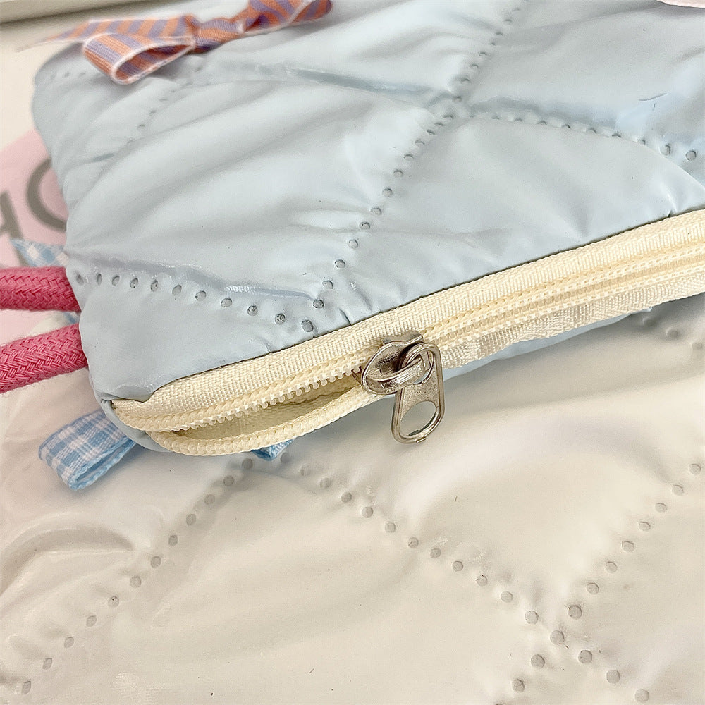 リボンモチーフキルティングポーチ