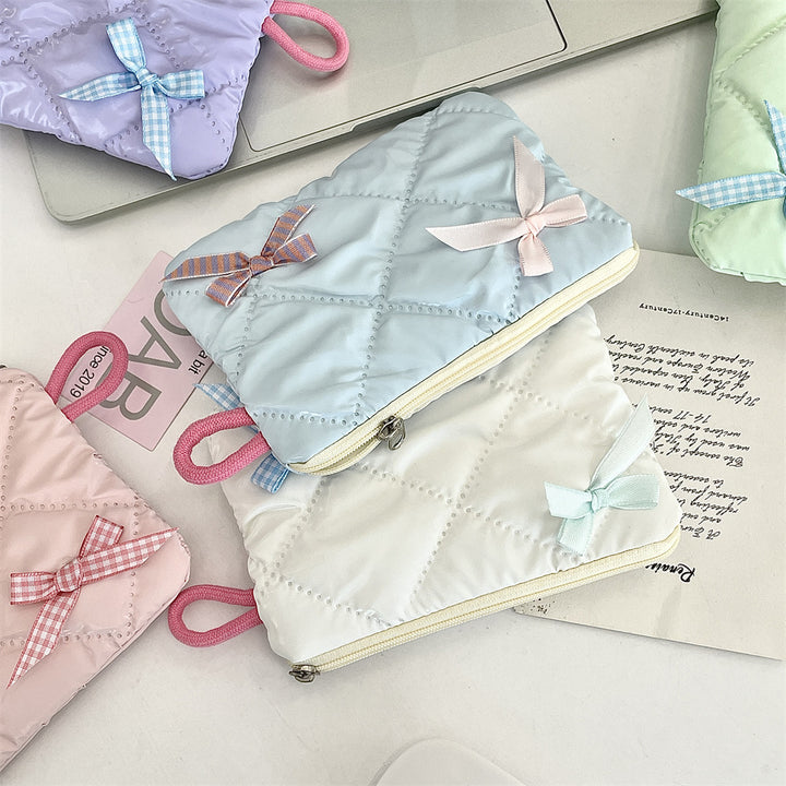 リボンモチーフキルティングポーチ